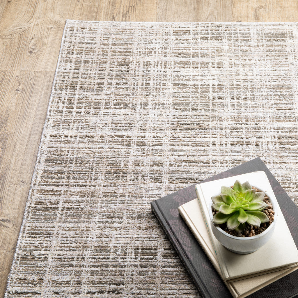 2' X 8' Beige Grey Ivory Tan And Brown Abstract Power Loom Stain