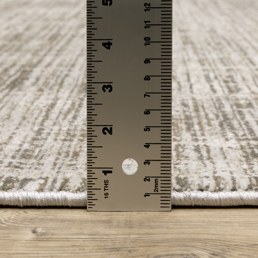 2' X 8' Beige Grey Ivory Tan And Brown Abstract Power Loom Stain